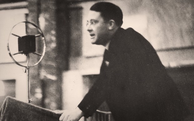 Political theorist Carl Schmitt speaking at a podium, known for his controversial ideas on sovereignty and friend–enemy politics