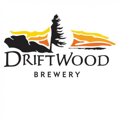 Driftwood Brewing’s name and a windswept tree silhouette against an orange-streaked sunset sky